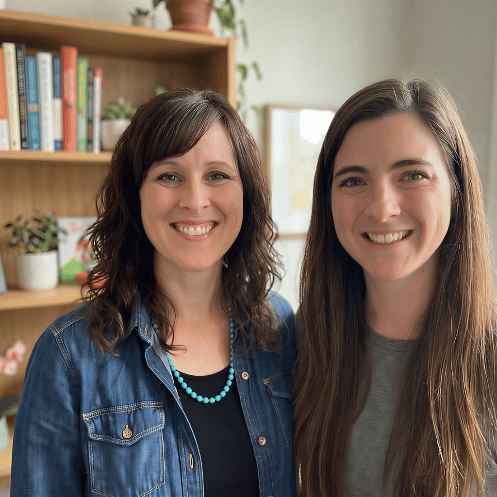 Heather Herman, NP-C and Alyssa Ramirez, PA-C standing in a welcoming office with a bookshelf behind them welcoming clients to Joy Spring Mental Health